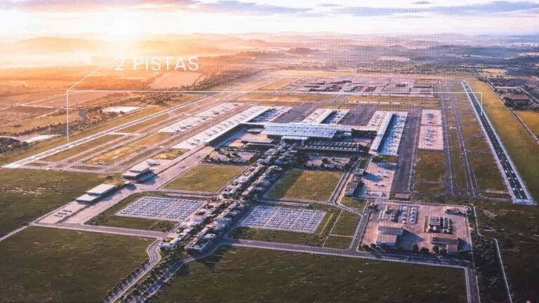 Computer-generated aerial view at sunset of a large airport on a flat plain: two long parallel runways, a central terminal with piers and aircraft, car parks and roads in front.